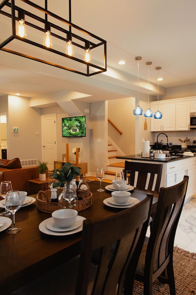 dining room featuring sink