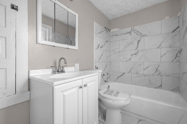 1371 E 23rd Ave, Columbus, OH 43211 - bathroom with toilet, vanity, marble look tiles, shower / bathtub combination, and a textured ceiling