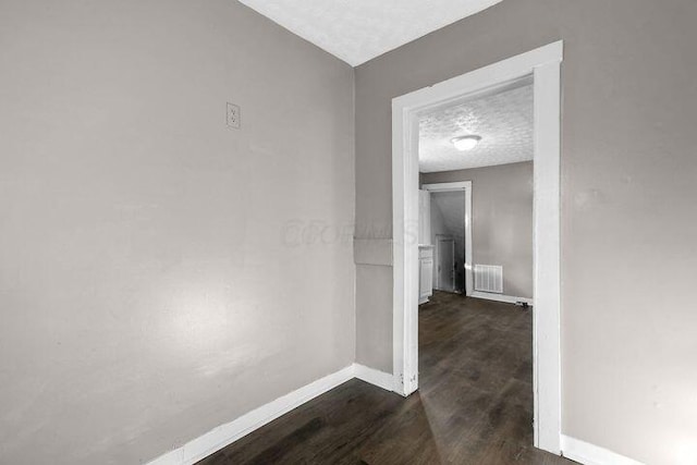 1371 E 23rd Ave, Columbus, OH 43211 - corridor featuring baseboards and dark wood finished floors
