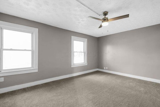 1371 E 23rd Ave, Columbus, OH 43211 - carpeted spare room with a textured ceiling, baseboards, and ceiling fan