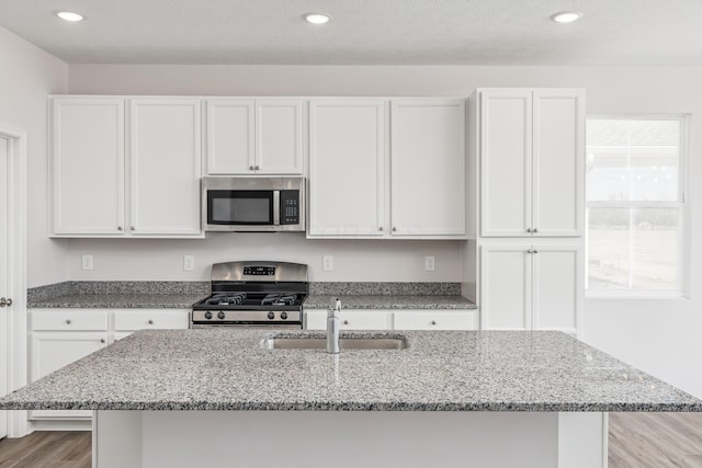 800 Heritage Blvd, Delaware, OH 43015 - kitchen featuring a sink, white cabinetry, and appliances with stainless steel finishes