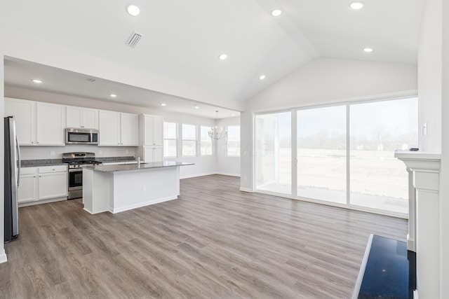 800 Heritage Blvd, Delaware, OH 43015 - kitchen with vaulted ceiling, a sink, white cabinets, stainless steel appliances, and recessed lighting