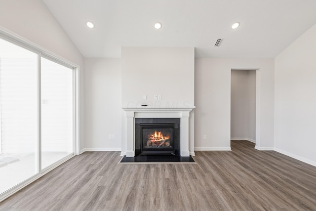 800 Heritage Blvd, Delaware, OH 43015 - unfurnished living room featuring visible vents, wood finished floors, baseboards, recessed lighting, and a fireplace with flush hearth