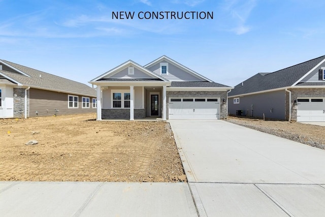 800 Heritage Blvd, Delaware, OH 43015 - craftsman inspired home with a porch, concrete driveway, and a garage