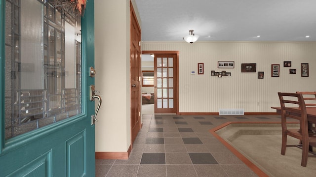 interior space featuring french doors and ornamental molding