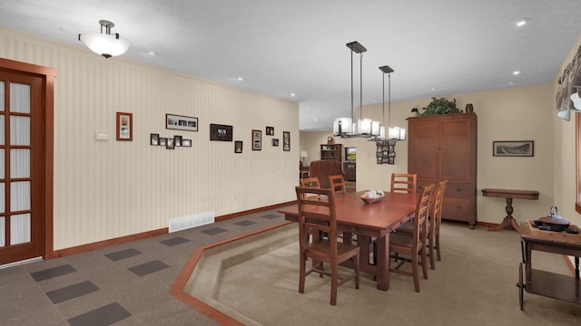 dining room with a textured ceiling and carpet floors