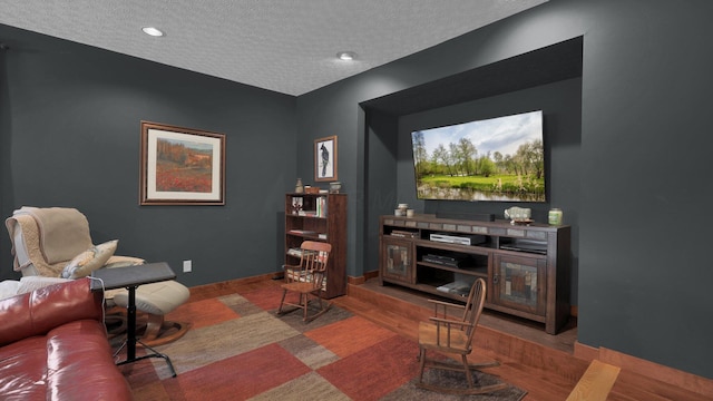 living room featuring a textured ceiling