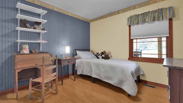 bedroom featuring hardwood / wood-style flooring