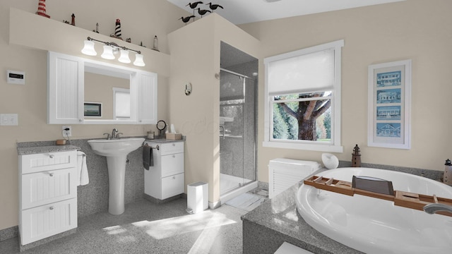 bathroom featuring sink and shower with separate bathtub