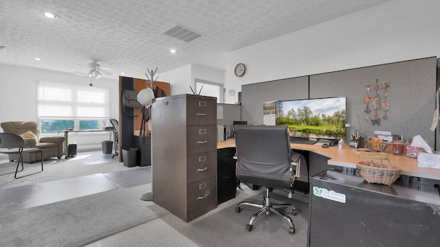 office space with ceiling fan and a textured ceiling