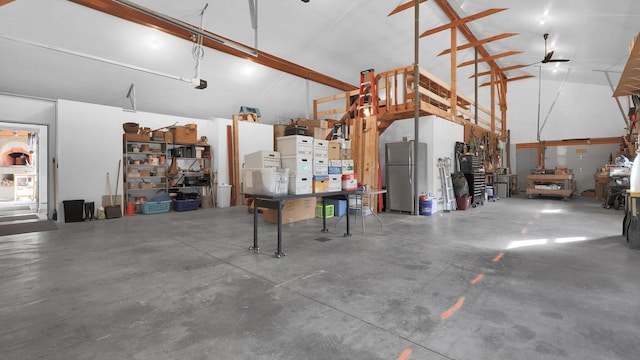 garage with stainless steel refrigerator and ceiling fan