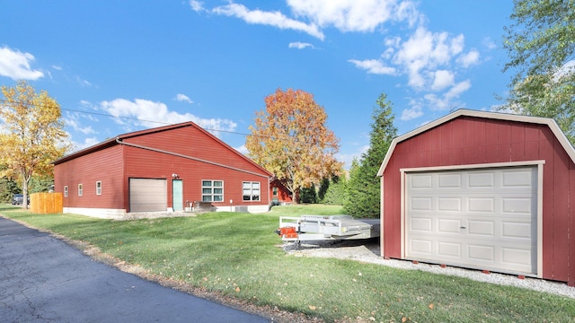 garage featuring a yard