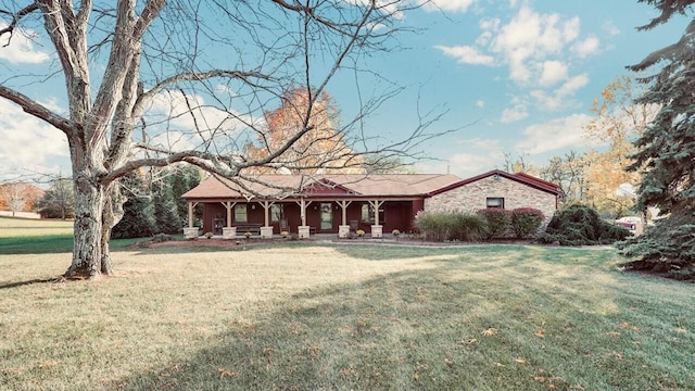 ranch-style home with a front yard