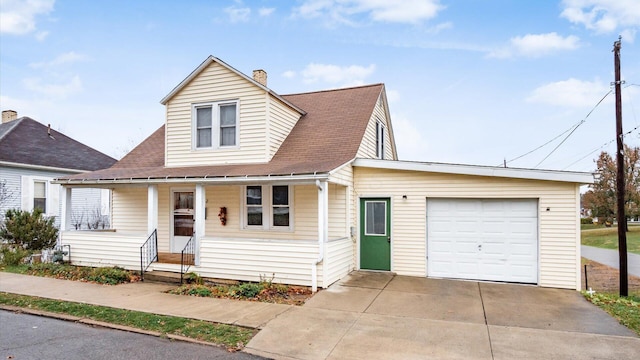 view of front of home with covered porch and a garage