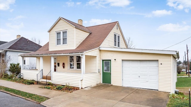 view of front of property featuring covered porch and a garage