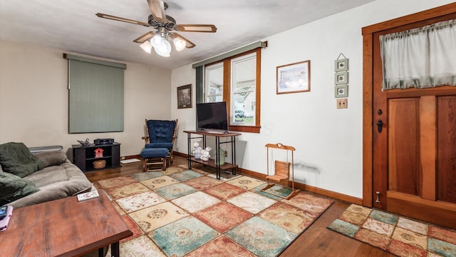 living room with ceiling fan and light wood-type flooring