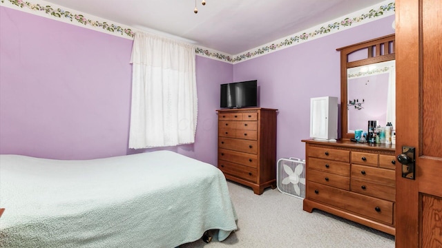 bedroom with light carpet