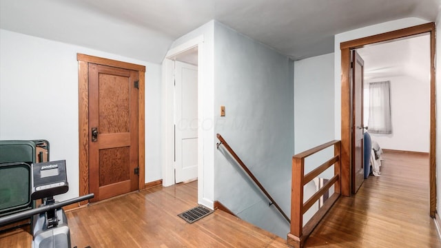 hallway featuring hardwood / wood-style flooring