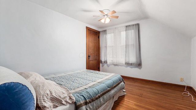 bedroom featuring wood-type flooring, ceiling fan, and lofted ceiling