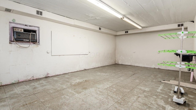 basement featuring a wall unit AC