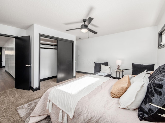 carpeted bedroom with a closet and ceiling fan