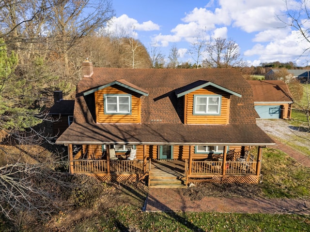 back of property featuring a porch