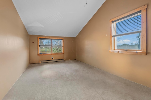 unfurnished room with carpet flooring, lofted ceiling, and a baseboard heating unit