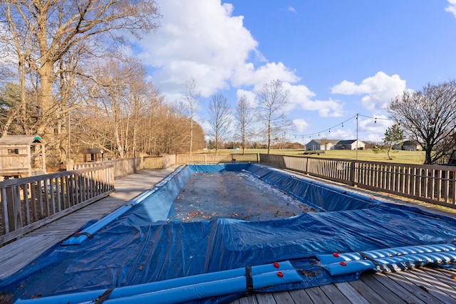 view of swimming pool featuring a deck