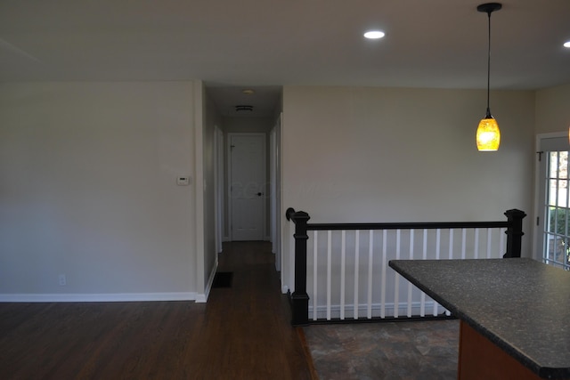 corridor with dark wood-type flooring