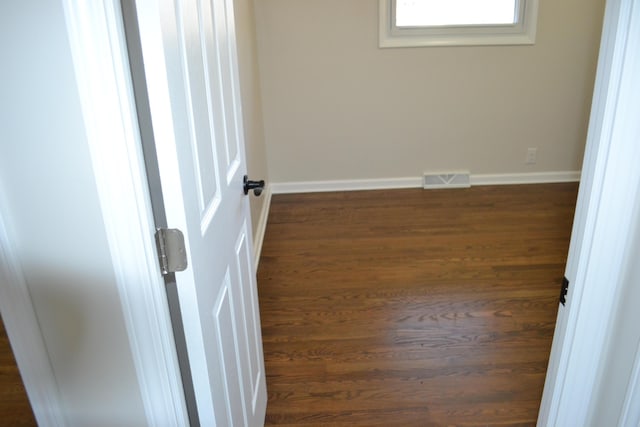 spare room featuring dark hardwood / wood-style flooring