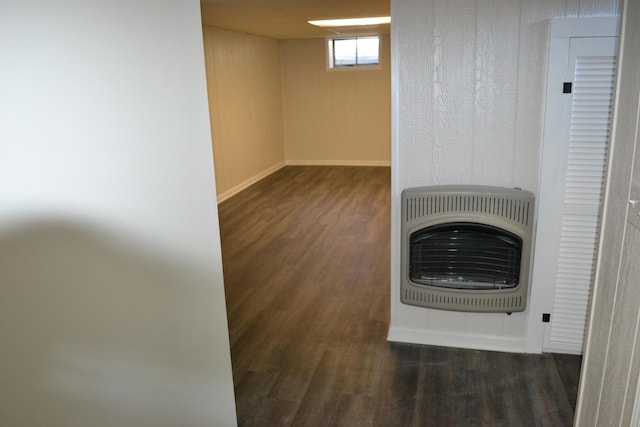 room details with heating unit and hardwood / wood-style floors