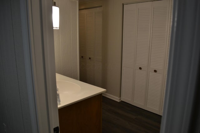 bathroom with vanity and hardwood / wood-style flooring