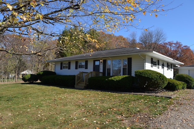 ranch-style house with a front yard