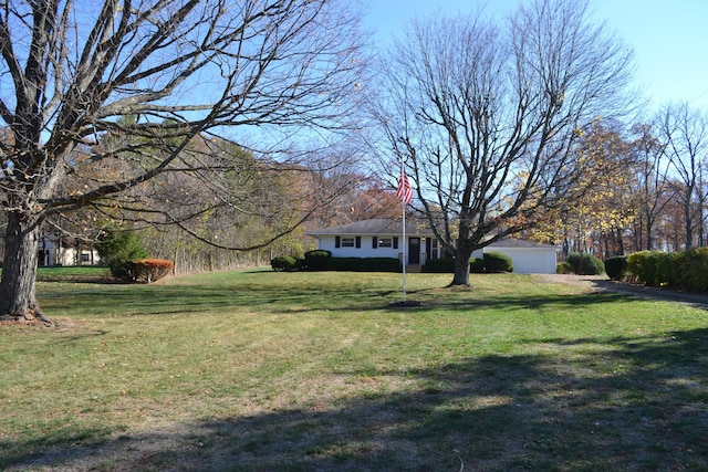 view of yard featuring a garage