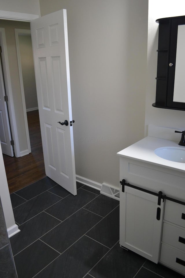 bathroom featuring tile patterned floors and vanity