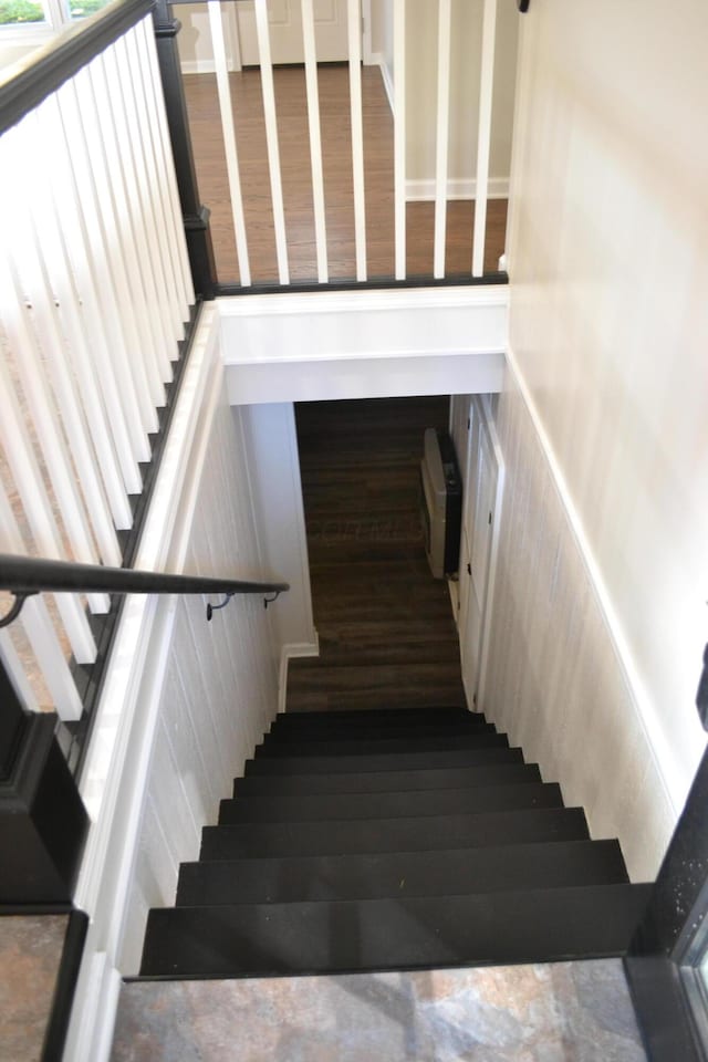 stairway featuring hardwood / wood-style floors