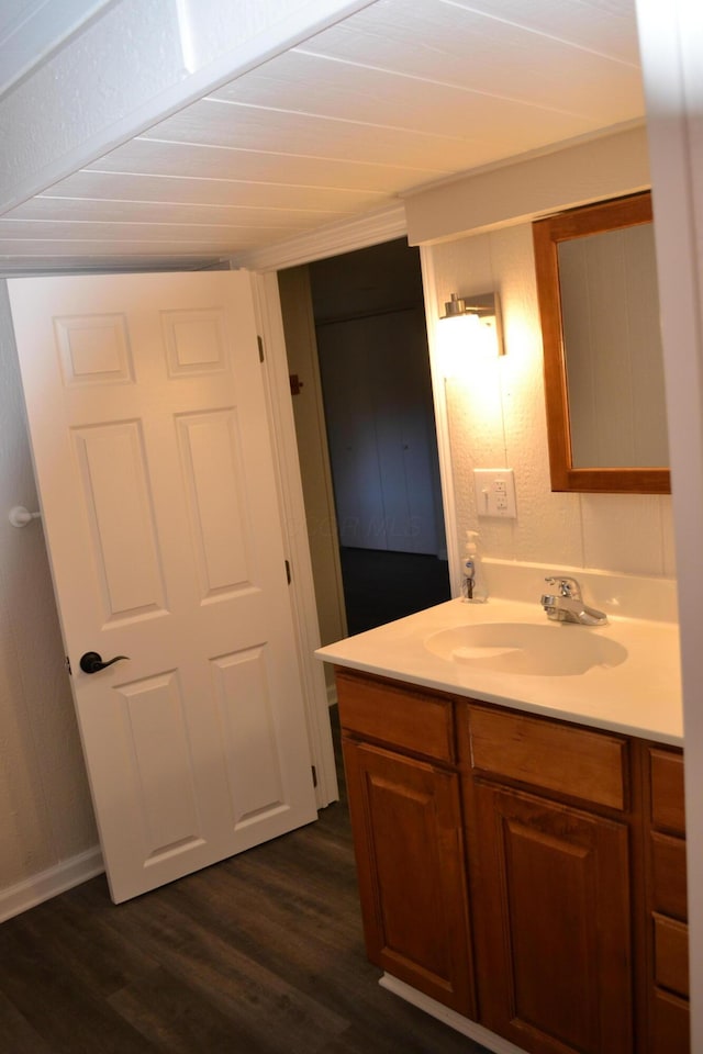 bathroom featuring hardwood / wood-style floors and vanity