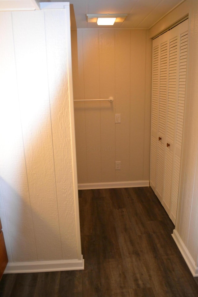 corridor featuring dark hardwood / wood-style flooring