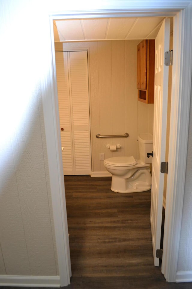 bathroom featuring hardwood / wood-style floors and toilet