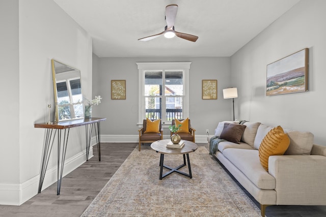 living room featuring ceiling fan and wood-type flooring