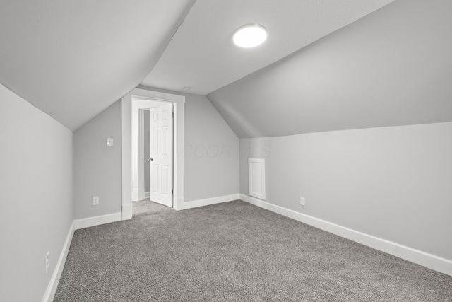 bonus room featuring carpet floors and lofted ceiling