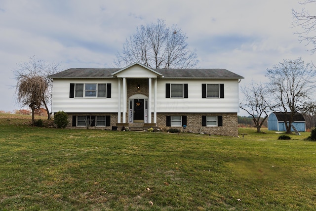 split foyer home featuring a shed and a front lawn