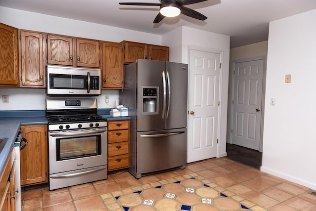 kitchen with ceiling fan and appliances with stainless steel finishes