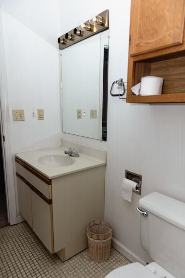 bathroom with vanity and toilet