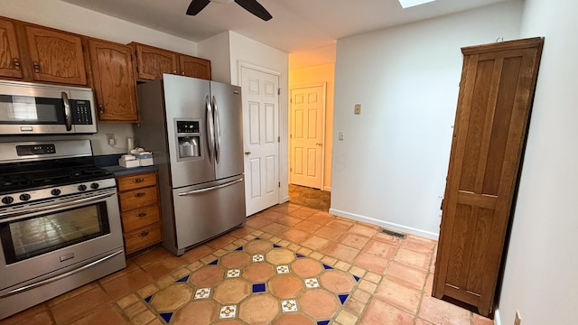 kitchen with appliances with stainless steel finishes and ceiling fan