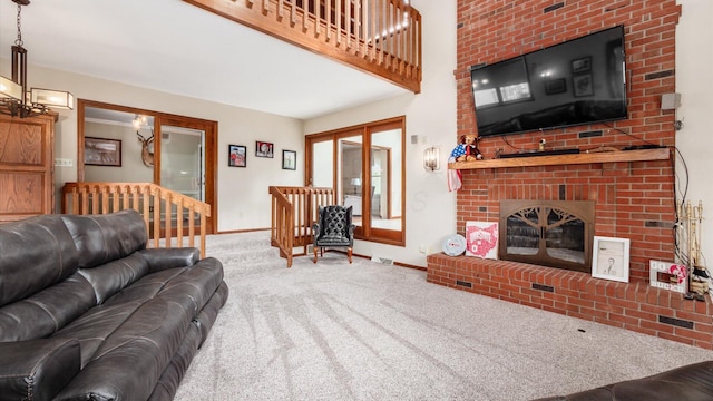 living room with carpet and a brick fireplace