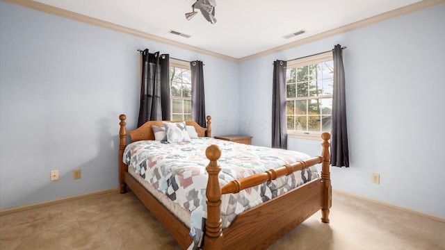 bedroom featuring multiple windows, light carpet, and crown molding