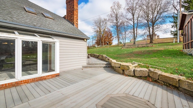 wooden terrace with a yard