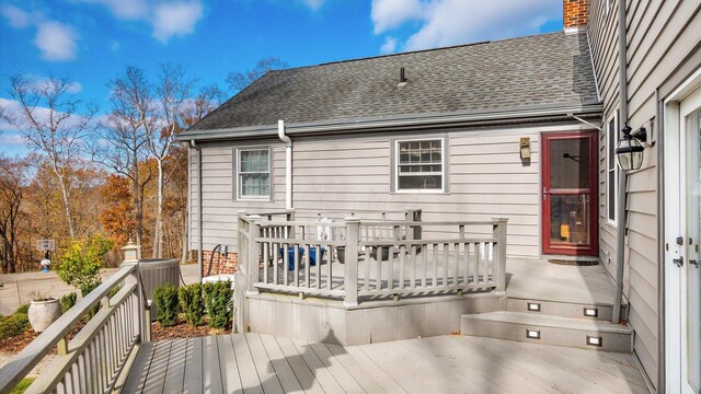 back of house featuring a deck