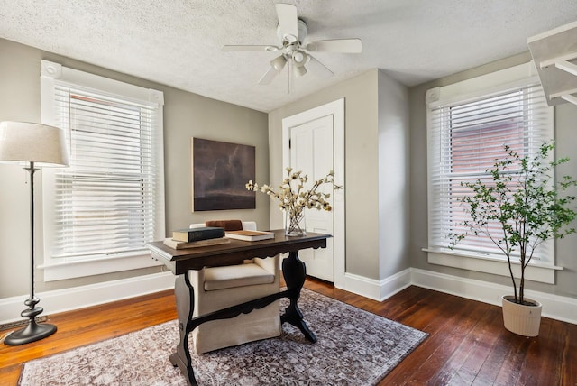 office area with dark hardwood / wood-style flooring, ceiling fan, plenty of natural light, and a textured ceiling